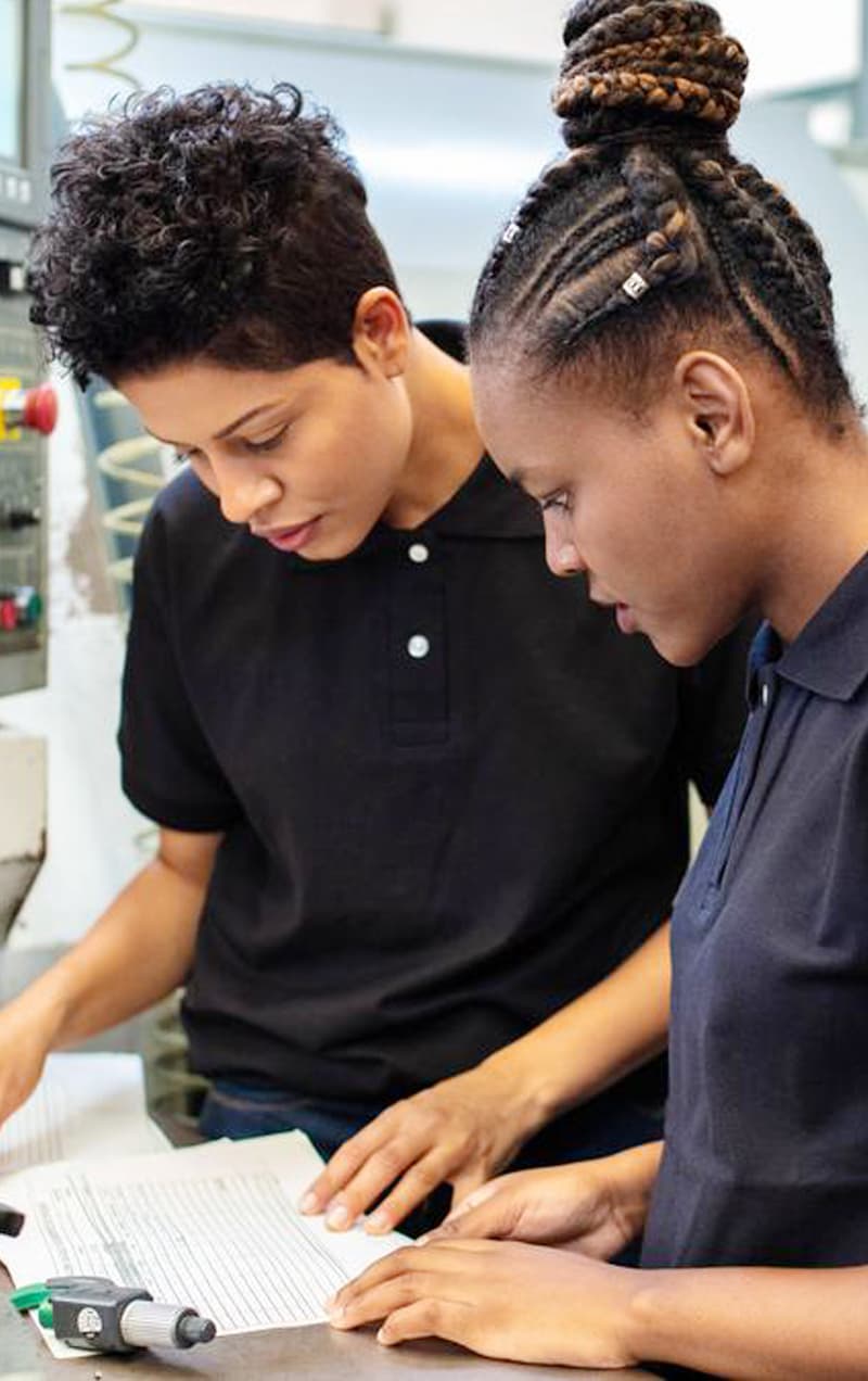 Learners working together in a practical training setting